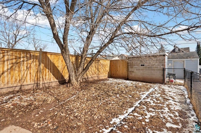 view of yard with a fenced backyard