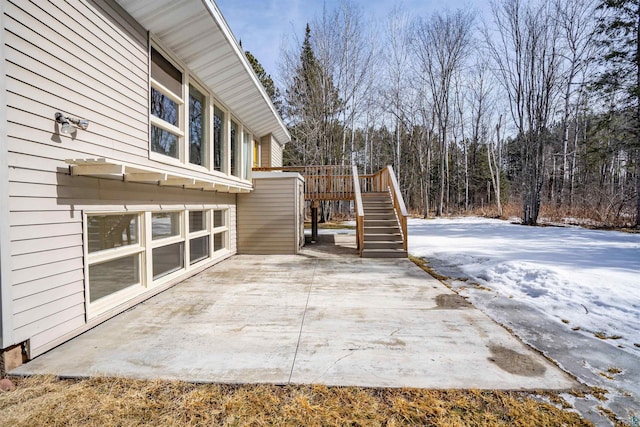 view of patio / terrace with stairway and a wooden deck