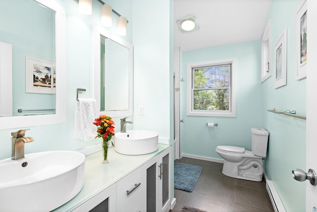 full bathroom with tile patterned flooring, a baseboard radiator, toilet, and a sink