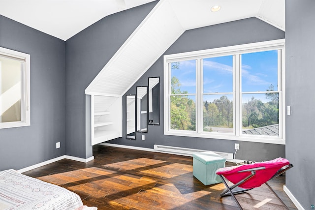 bedroom featuring lofted ceiling, hardwood / wood-style flooring, and baseboards