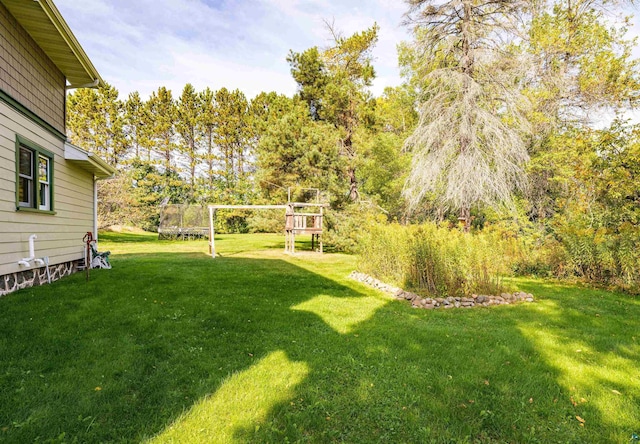 view of yard with a trampoline