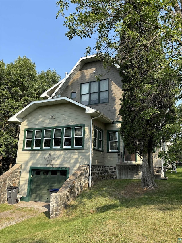 exterior space featuring a yard and a garage