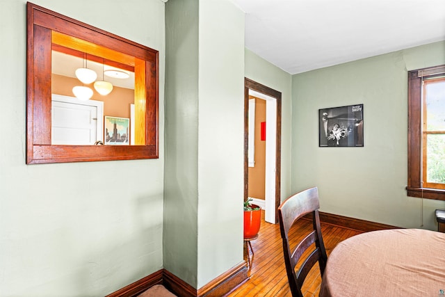 interior space featuring hardwood / wood-style floors and baseboards