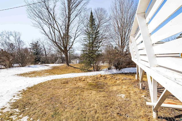 view of yard layered in snow