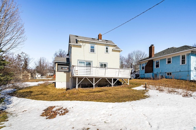 rear view of house with a wooden deck