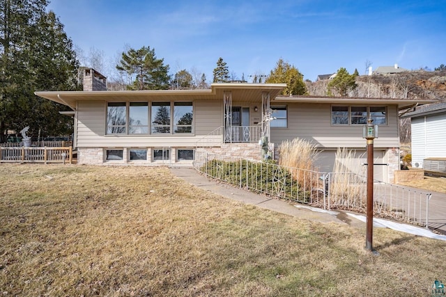 single story home featuring a front lawn, an attached garage, fence, and a chimney