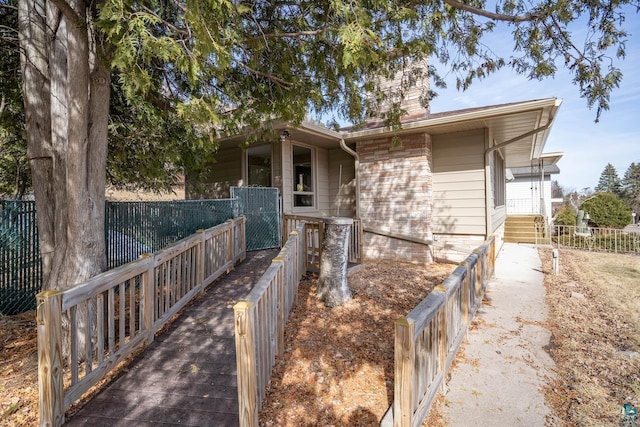 view of front of house with fence and a chimney