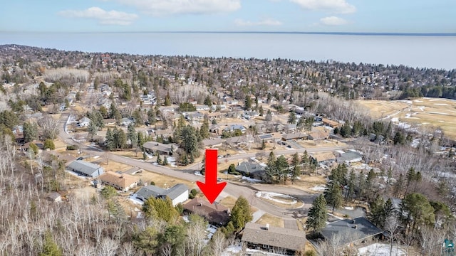 bird's eye view featuring a residential view and a water view