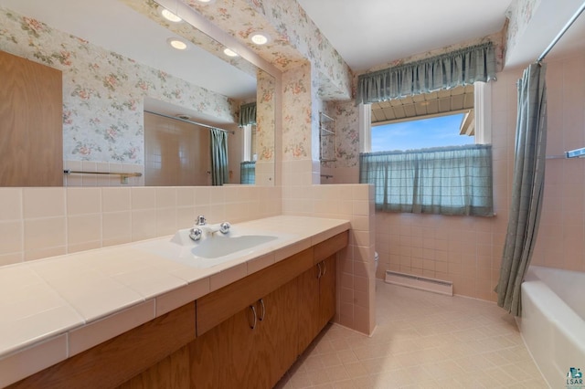 full bath with wallpapered walls, tile walls, a wainscoted wall, vanity, and a baseboard radiator