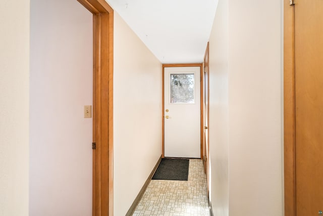 corridor featuring baseboards