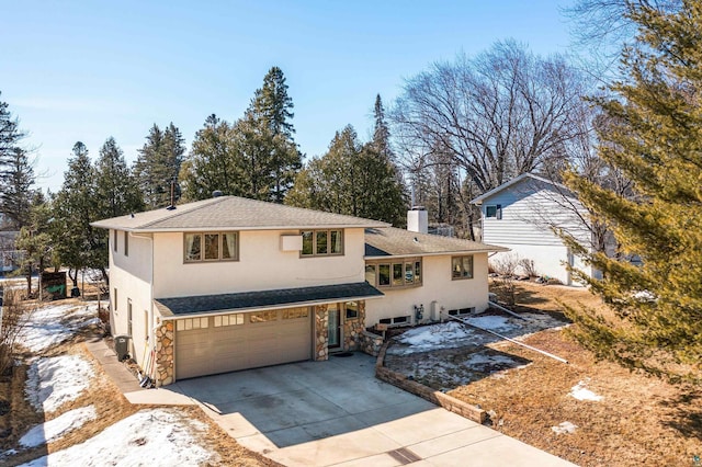 view of front of house with stucco siding, stone siding, concrete driveway, a garage, and a chimney