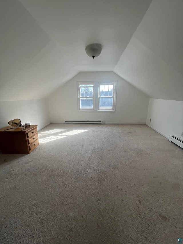 bonus room featuring baseboard heating, baseboards, carpet, and lofted ceiling