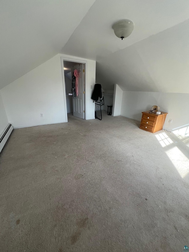 bonus room with carpet and vaulted ceiling