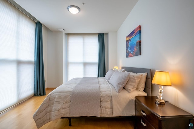 bedroom featuring wood finished floors