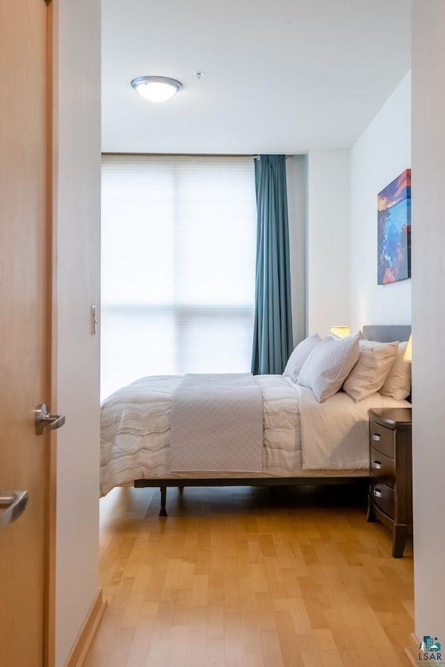 bedroom featuring light wood finished floors