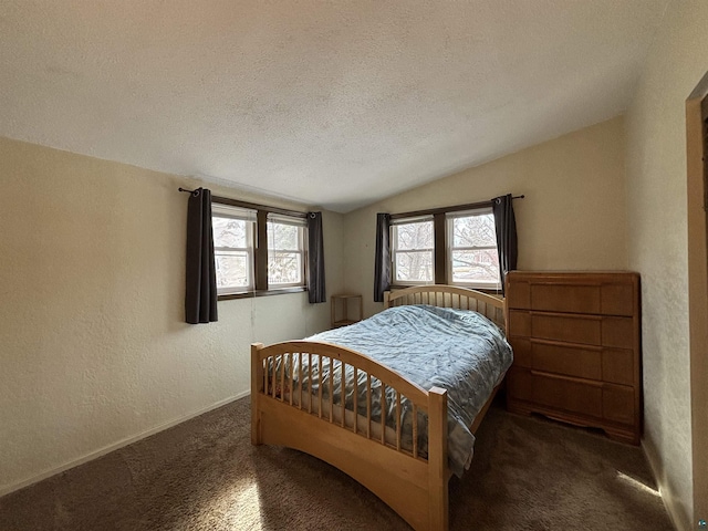 carpeted bedroom with baseboards, lofted ceiling, a textured ceiling, and a textured wall