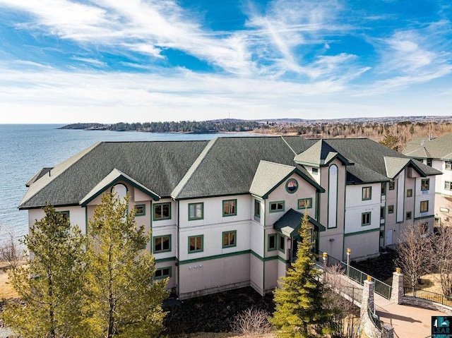 birds eye view of property with a residential view and a water view