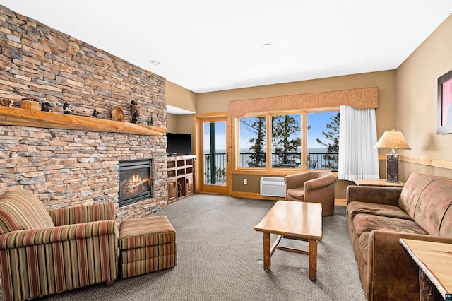 carpeted living room featuring a wall mounted air conditioner and a fireplace