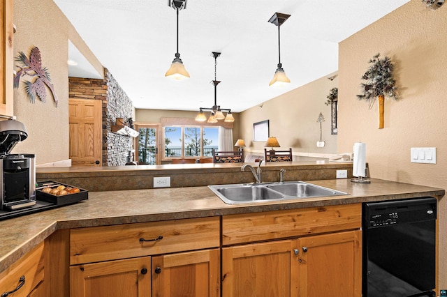 kitchen featuring a peninsula, a sink, pendant lighting, dishwasher, and dark countertops