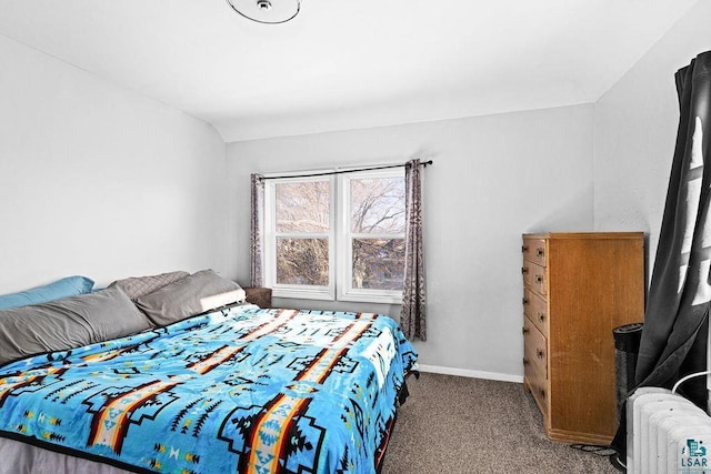 carpeted bedroom with baseboards and radiator heating unit