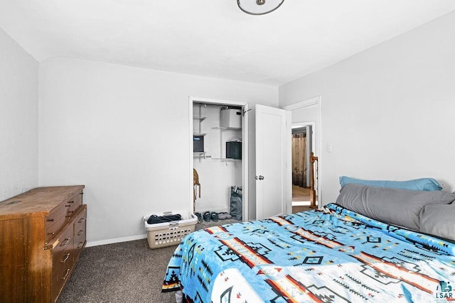 bedroom with baseboards and dark carpet