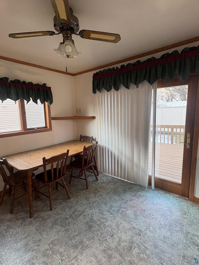 unfurnished dining area featuring a ceiling fan and ornamental molding