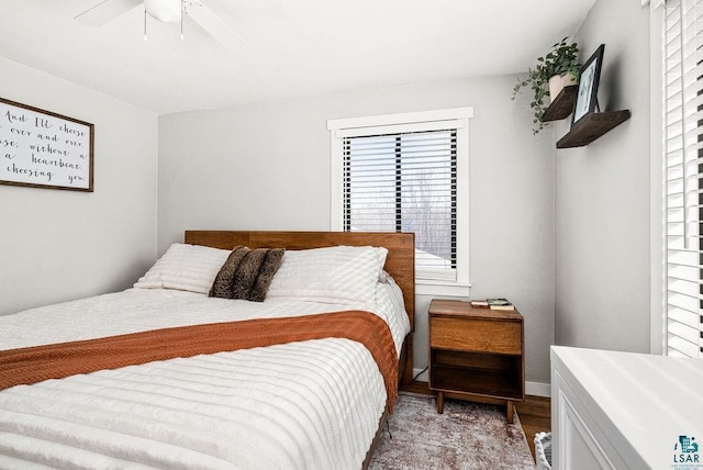 bedroom with wood finished floors and ceiling fan