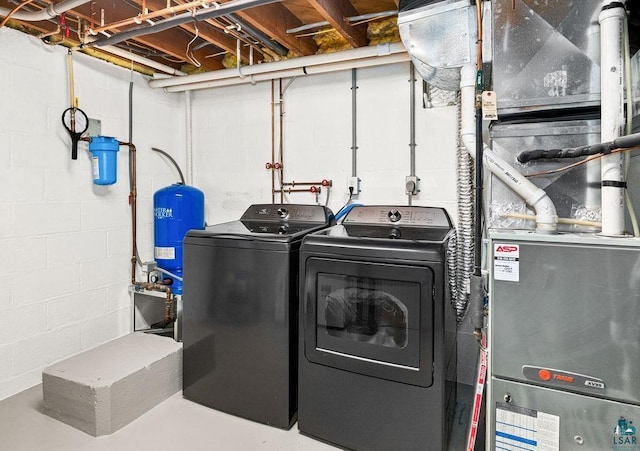 washroom featuring laundry area and washer and clothes dryer