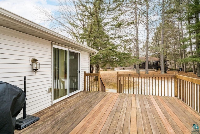 wooden deck featuring grilling area