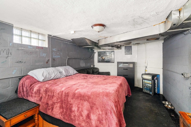 bedroom featuring a textured ceiling and concrete flooring