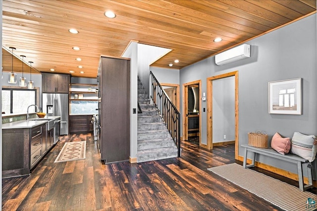 kitchen featuring a sink, stainless steel fridge, wood ceiling, and a wall mounted AC