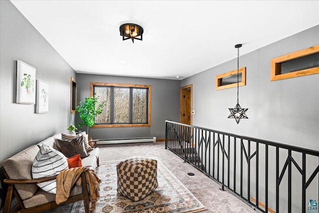 living area with an upstairs landing, carpet, baseboards, and baseboard heating