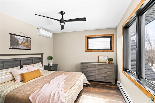 bedroom with dark wood-type flooring, multiple windows, baseboard heating, and a wall mounted AC