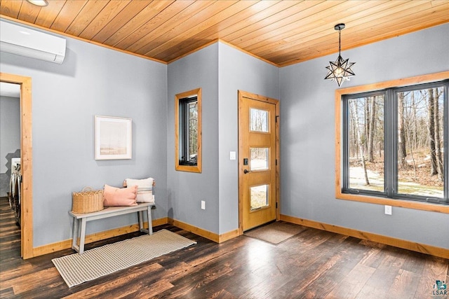 foyer with baseboards, a wall unit AC, ornamental molding, wooden ceiling, and wood finished floors