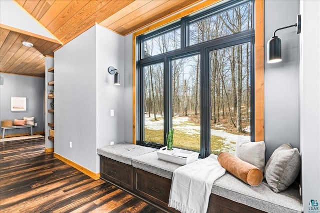 living area featuring baseboards, lofted ceiling, wood ceiling, and dark wood-style floors