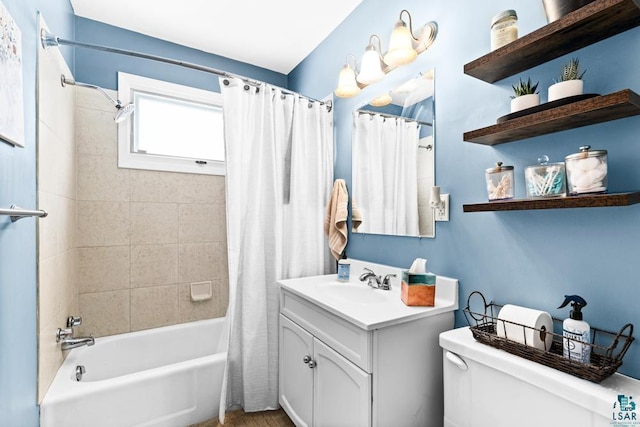 full bath with vanity, toilet, and shower / bath combo with shower curtain