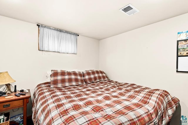 bedroom featuring visible vents