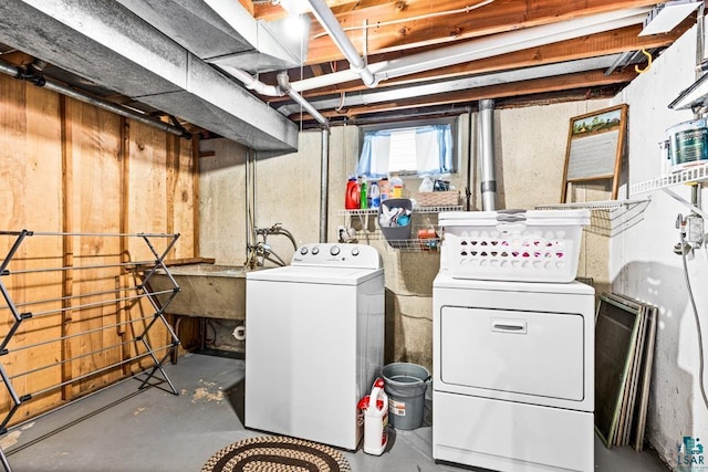 below grade area with independent washer and dryer and a sink