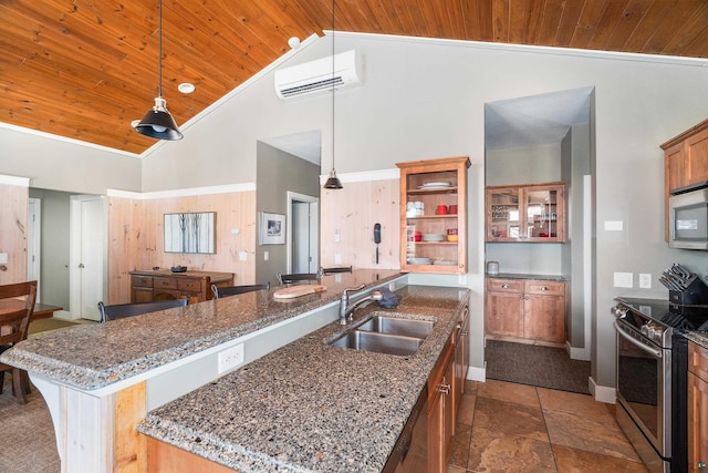 kitchen featuring high vaulted ceiling, an AC wall unit, a sink, appliances with stainless steel finishes, and wood ceiling