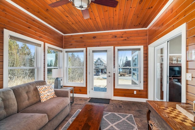 sunroom / solarium featuring wooden ceiling and ceiling fan