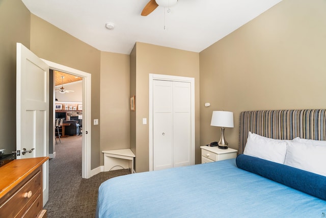 bedroom with a ceiling fan, a closet, dark carpet, and baseboards