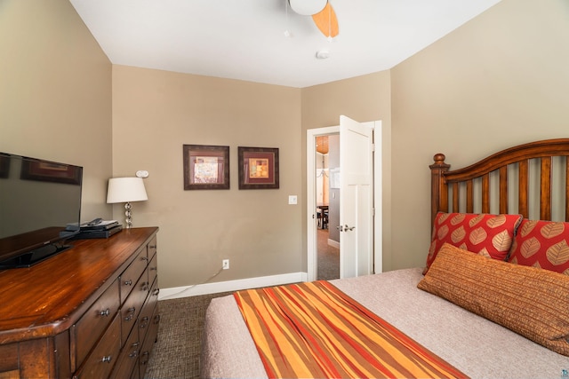 bedroom with baseboards and a ceiling fan