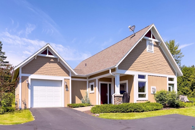 view of front of home featuring an attached garage and driveway