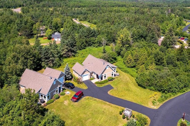 bird's eye view featuring a forest view