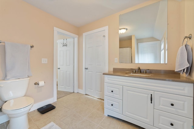 bathroom with baseboards, toilet, tile patterned flooring, and vanity