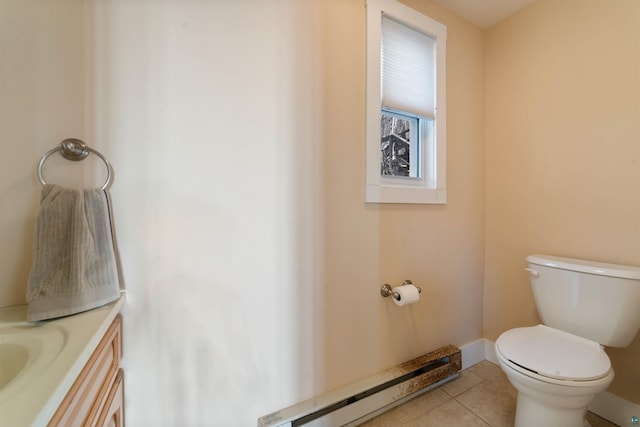 bathroom featuring tile patterned floors, toilet, vanity, a baseboard radiator, and baseboards