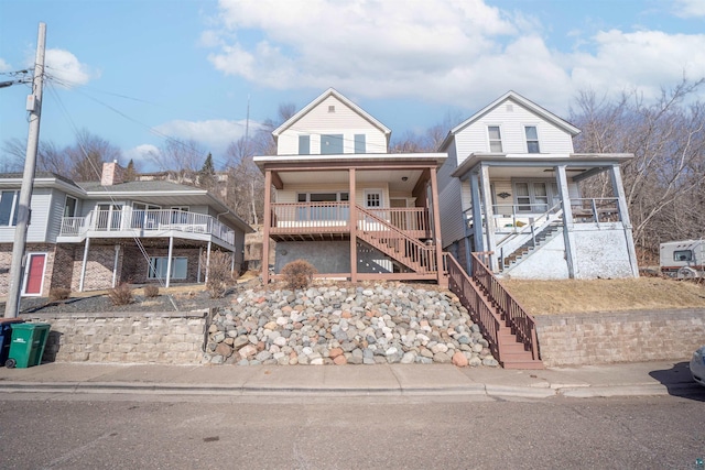 view of front of home with a porch and stairway