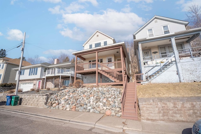 view of front of house with covered porch and stairway