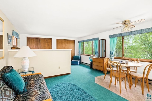 interior space with a baseboard radiator, carpet floors, and ceiling fan