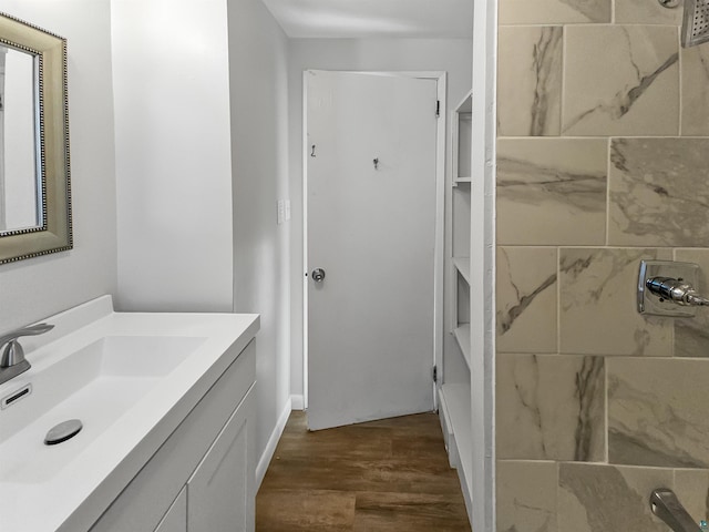 bathroom featuring vanity and wood finished floors